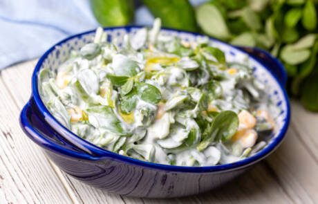 Purslane,Salad,With,Yogurt,In,Bowl,On,Wooden,Background.
