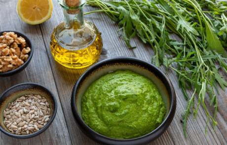 Wild,Arugula,Pesto,In,A,Bowl.,On,The,Side,Are