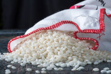 Paella,Rice,Spilled,From,A,Cloth,Bag