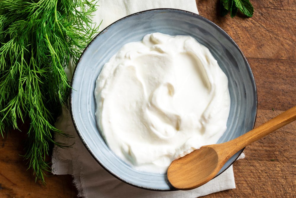 Homemade,Greek,Yogurt,And,Fresh,Dill,Herbs,On,Wooden,Background,